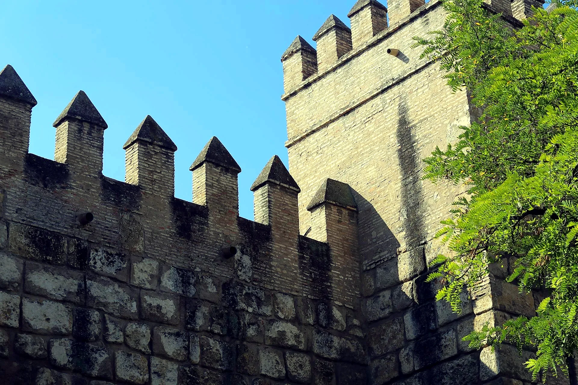 Seville cathedral vs alcazar comparison walls battlements