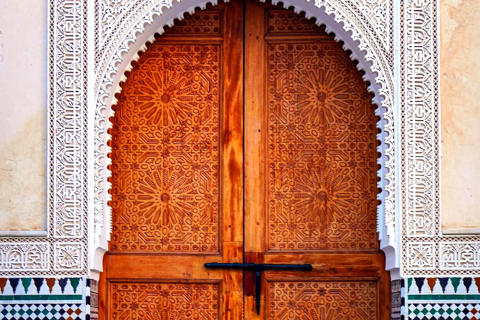 Carved wooden door in the Real Alcázar Seville - Alcazar vs Alhambra
