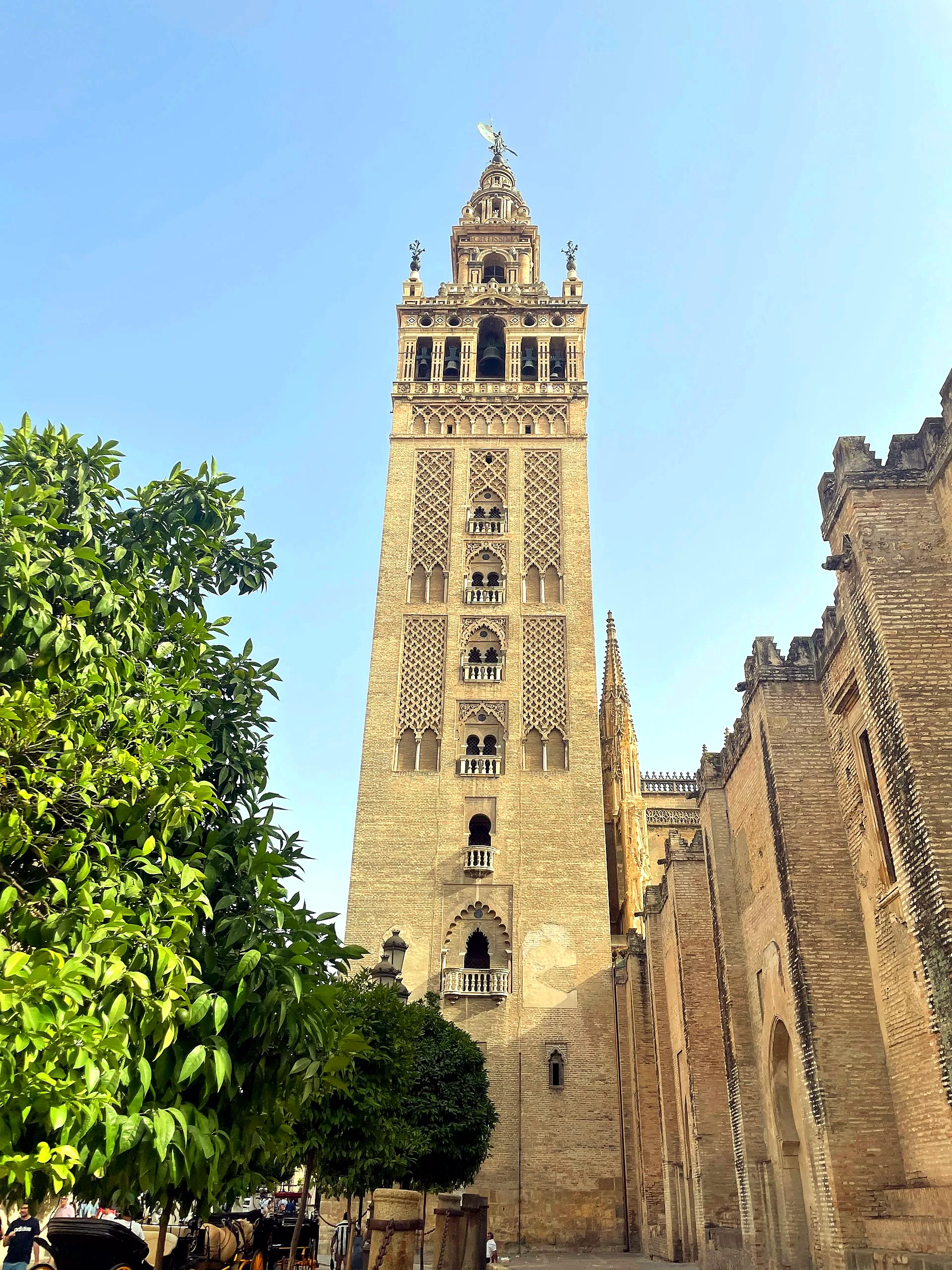 Full exterior of the Giralda tower showing its Almohad and Renaissance sections