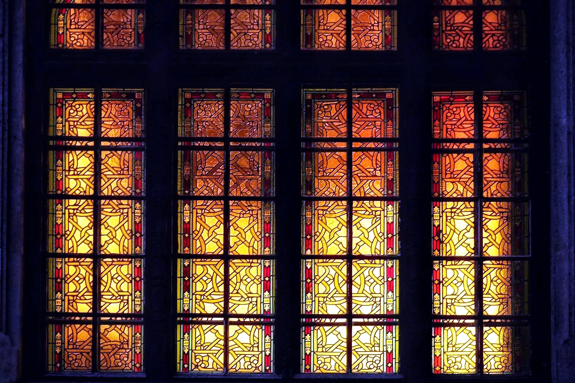 Seville Cathedral interior with coloured morning light from stained glass