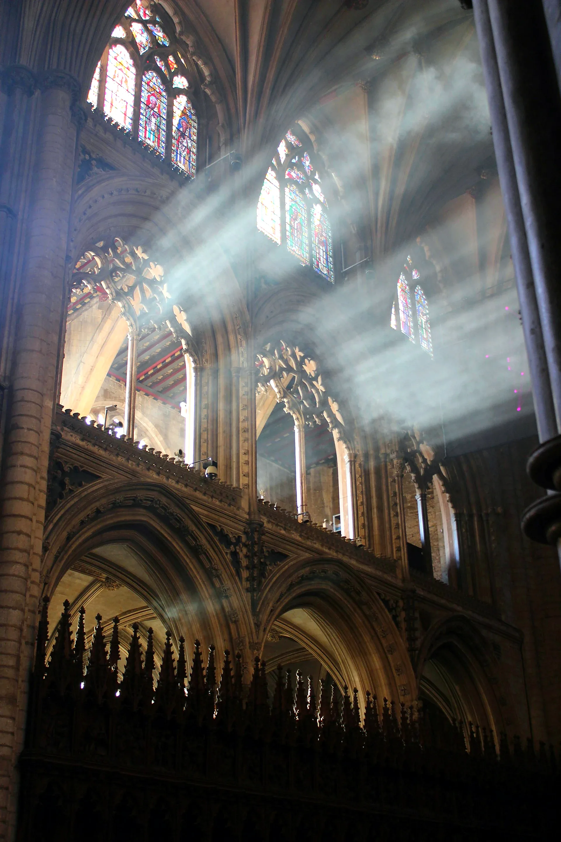 Morning light through Seville Cathedral stained glass windows