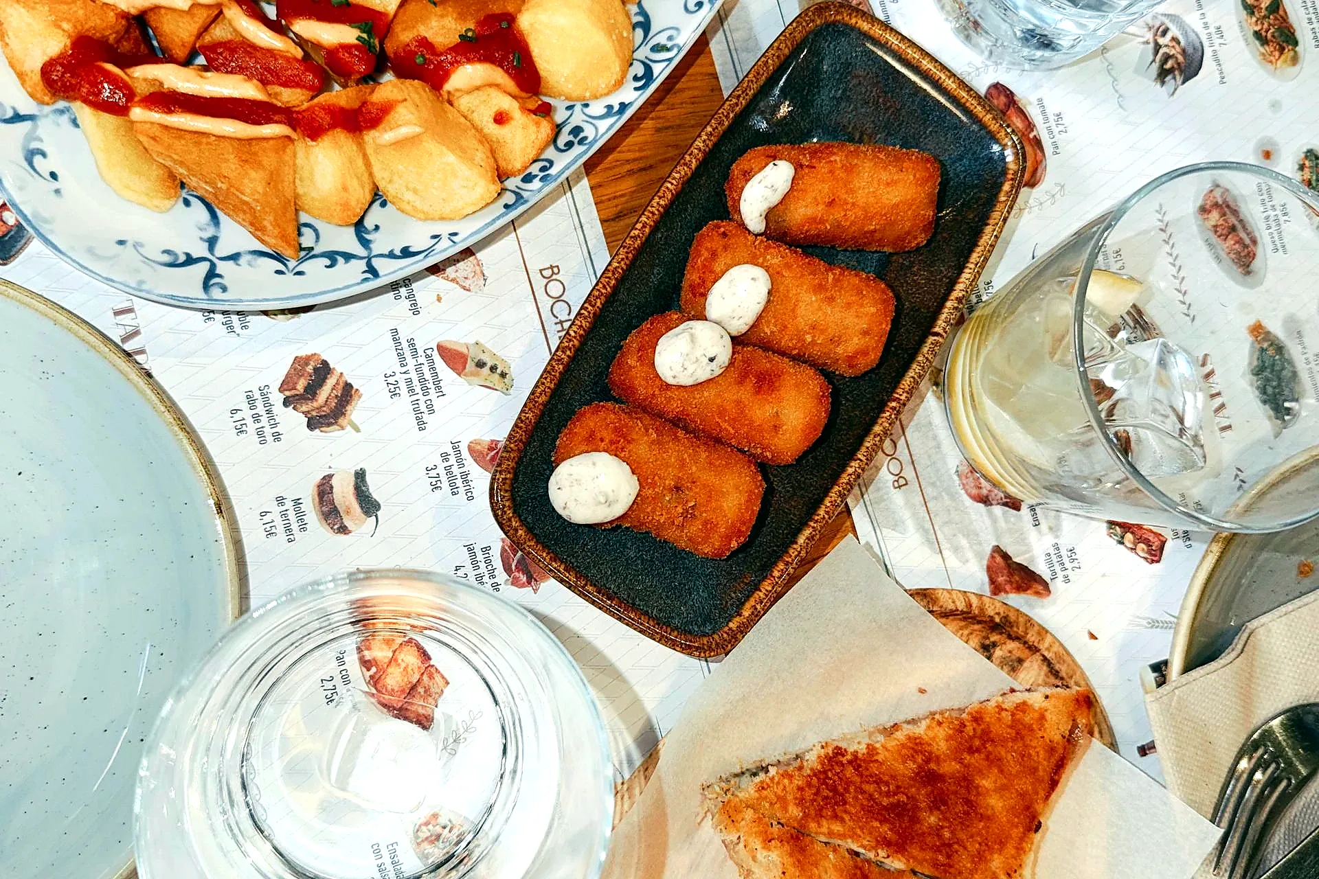 Tapas table overhead view Triana Seville tour route - tapas tours in Seville