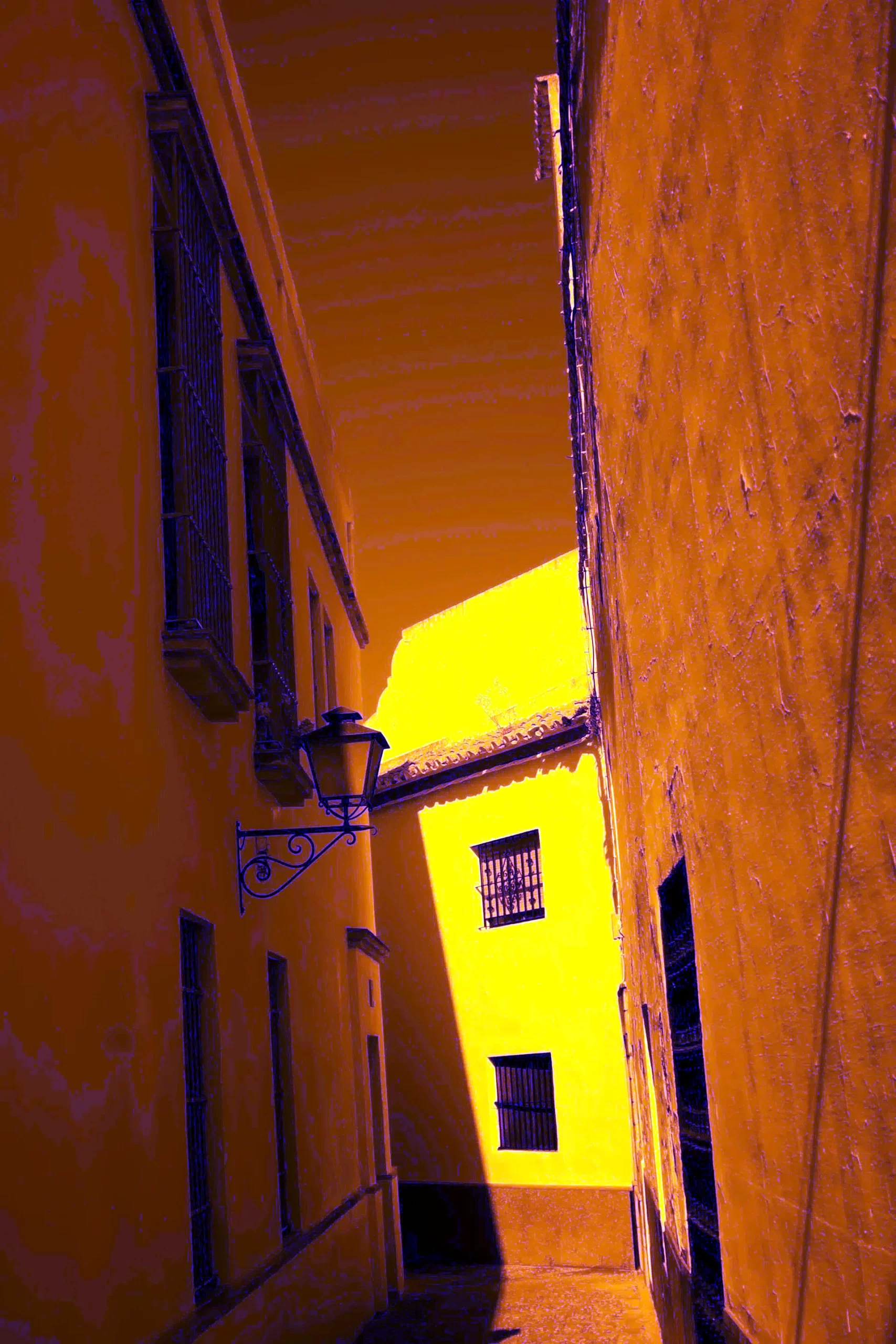 Lantern-lit alley in the Santa Cruz neighbourhood of Seville at night