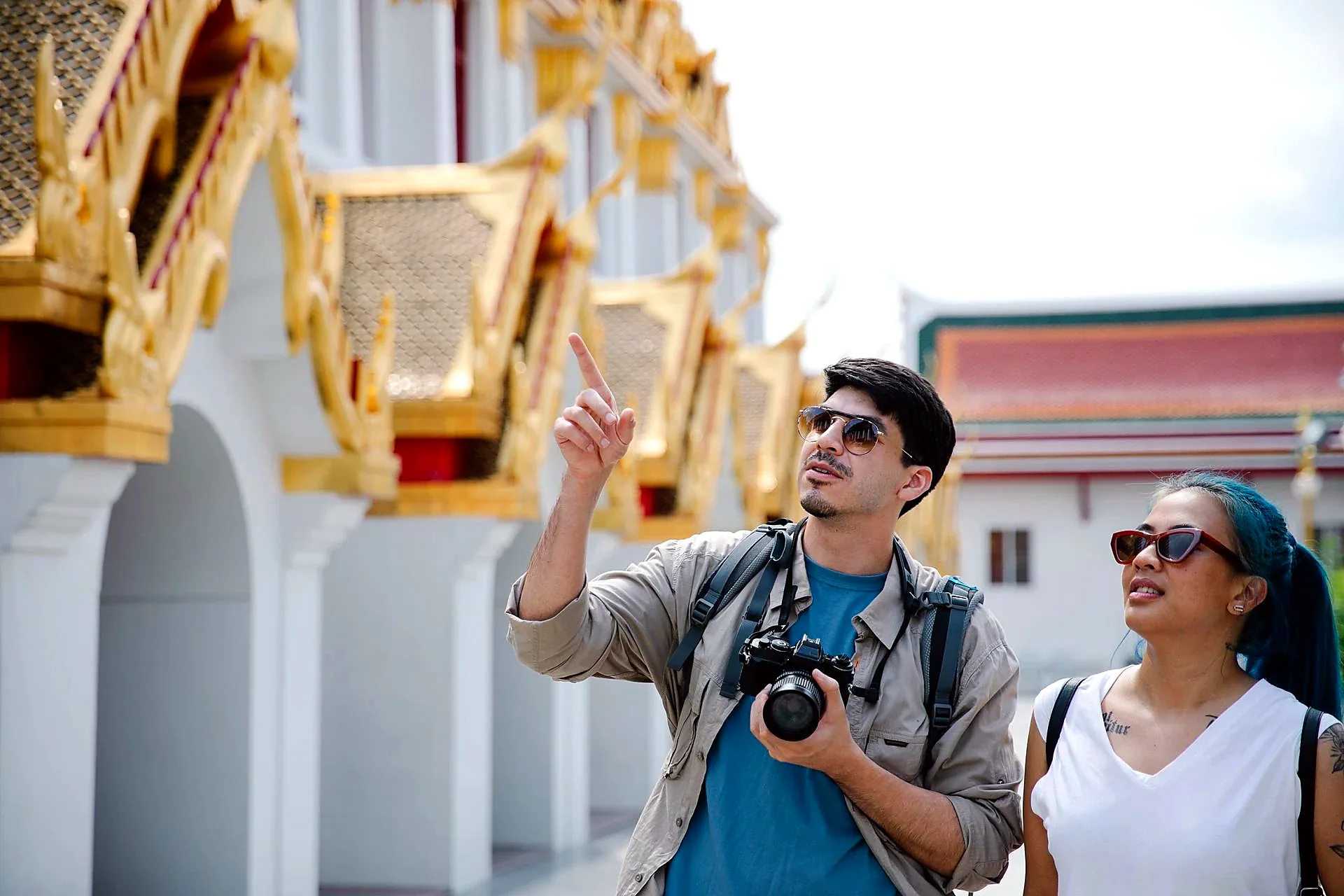 Specialist walking tour guide pointing historic detail Seville