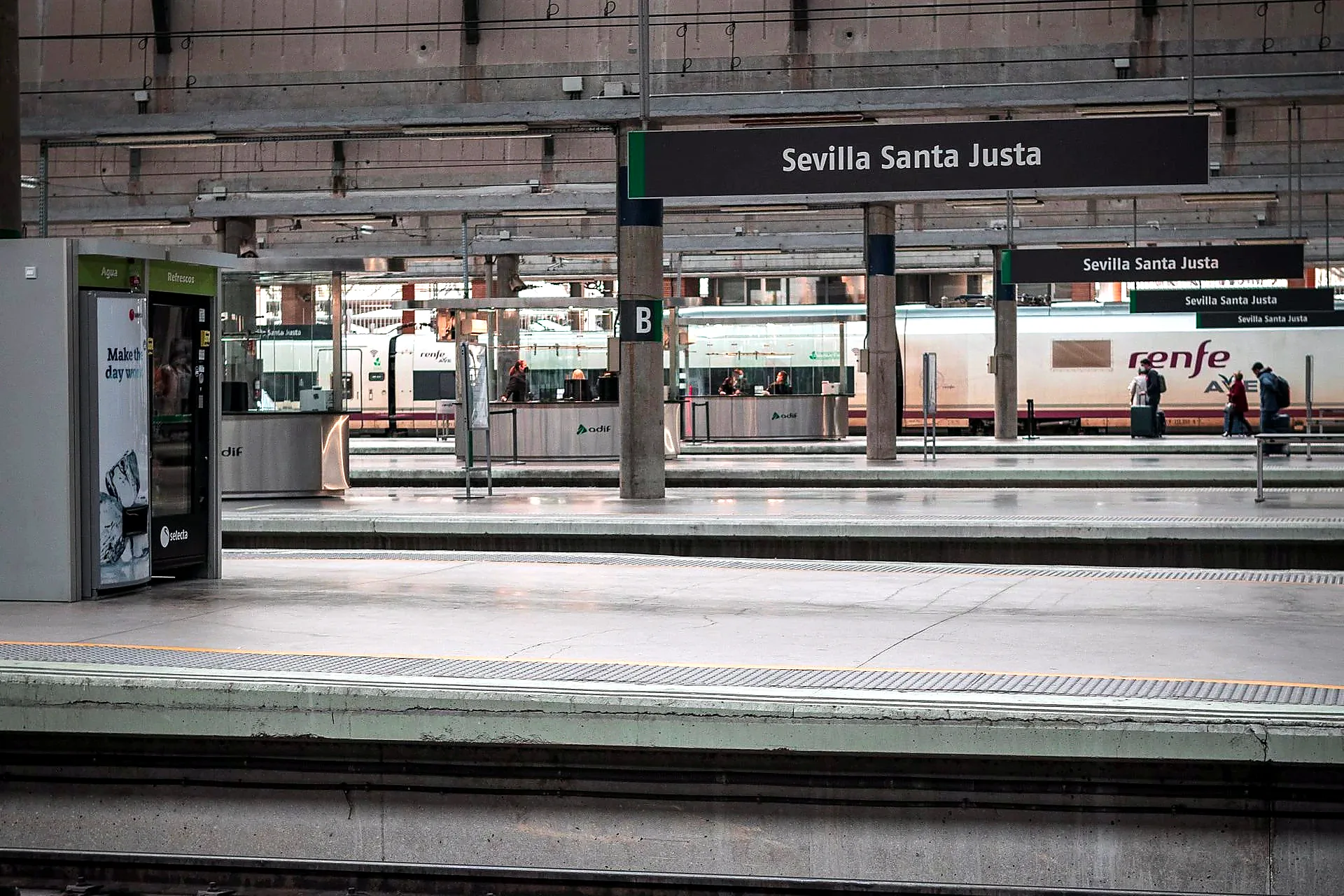 Train departure board showing services from Seville Santa Justa station - day trips from Seville by train